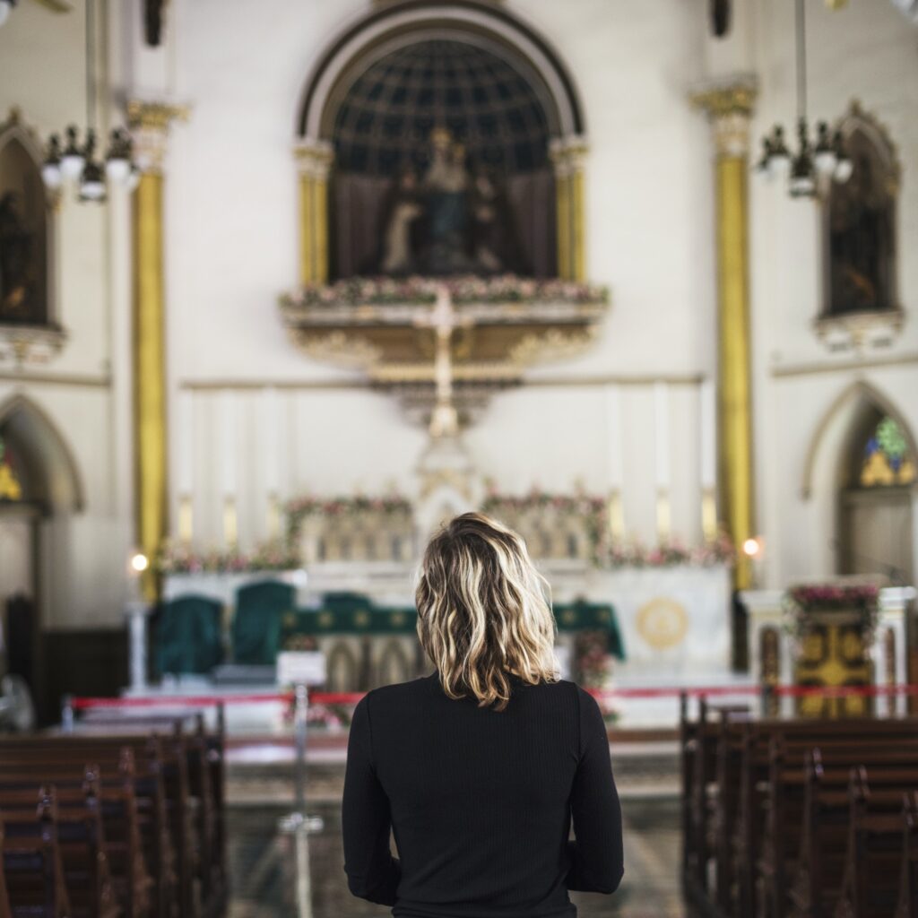 woman praying in the church jpg